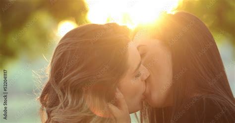 Lesbian Kiss LGBT Couple Passionately Kissing Outdoors At The Park