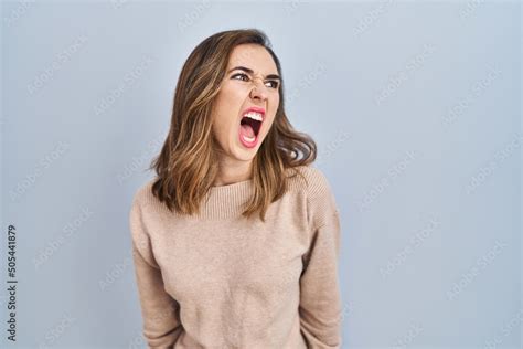 Young Woman Standing Over Isolated Background Angry And Mad Screaming