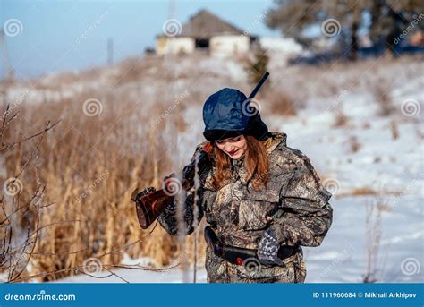 Female Hunter in Camouflage Clothes Ready To Hunt, Holding Gun a Stock ...