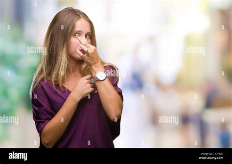 Young Beautiful Blonde Elegant Woman Over Isolated Background Smelling