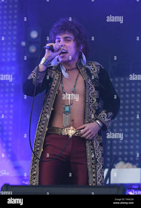 Singer Josh Kiszka Is Shown Performing On Stage During A Live Concert