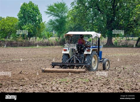 Indian Farmer Ploughing Field Tractor Hi Res Stock Photography And