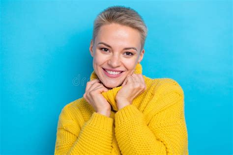 Photo Of Sweet Adorable Lady Wear Knit Sweater Comparing Arms Collar Smiling Isolated Blue Color