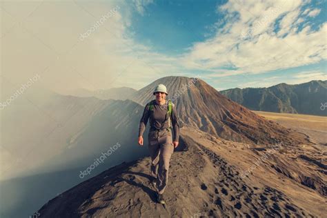 Tourist hiking in Bromo volcano Stock Photo by ©kamchatka 101231264