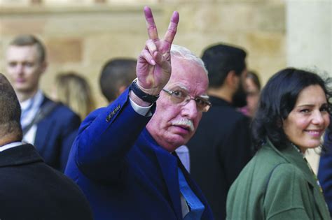 Palestinian Foreign Minister Riad Al Malki Flashes A Victory Sign In