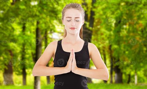 close up of yoga woman hands in namaste gesture on summer day light
