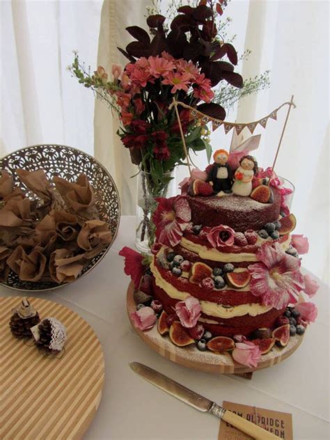 Naked Wedding Cake With Edible Flowers And Cake Toppers