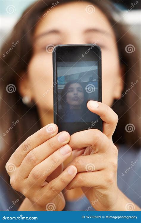 Female Hands Holding A Smart Phone And Taking Selfie Stock Image