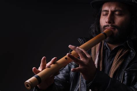 Premium Photo | Peruvian musician with andean instrument