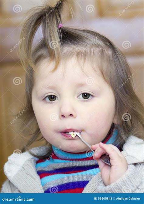 Little Girl With A Spoon In The Mouth Stock Photo Image Of Light