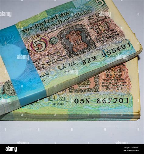 Old Five Rupee notes combined on the table, India money on the rotating ...