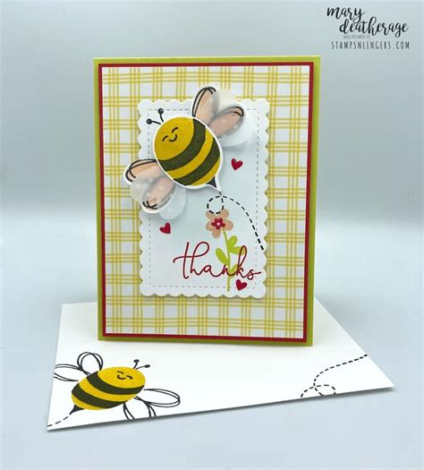 A Close Up Of A Card With A Bee On It