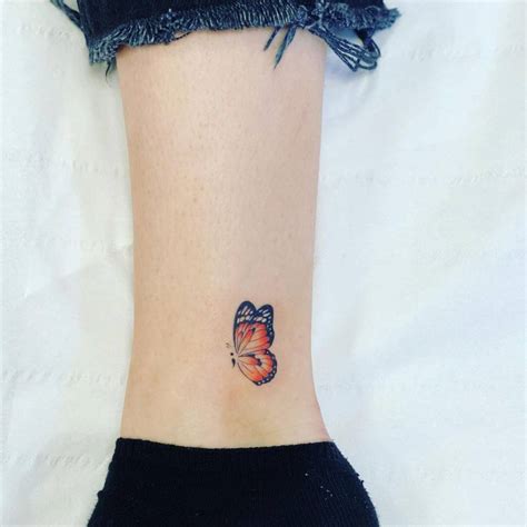 Orange Butterfly Tattoo On The Ankle