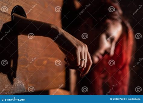 A Redhead Woman Is Imprisoned In A Wooden Pillory During Sex Games BDSM Erotic Fantasies