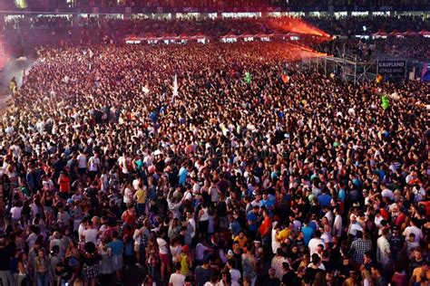 Large Crowd Of People At A Concert In The Front Of The Stage Editorial