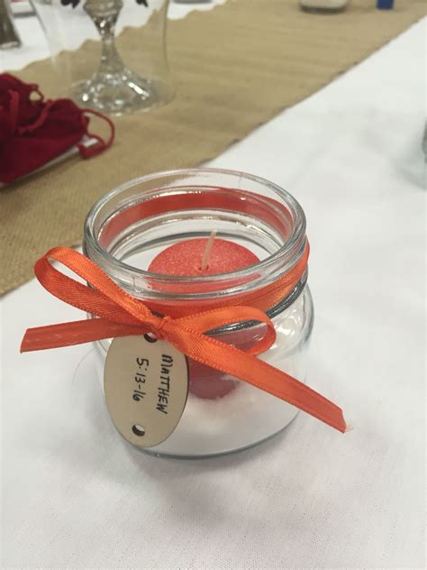 Small Mason Jar Filled With Salt With A Candle In The Middle The