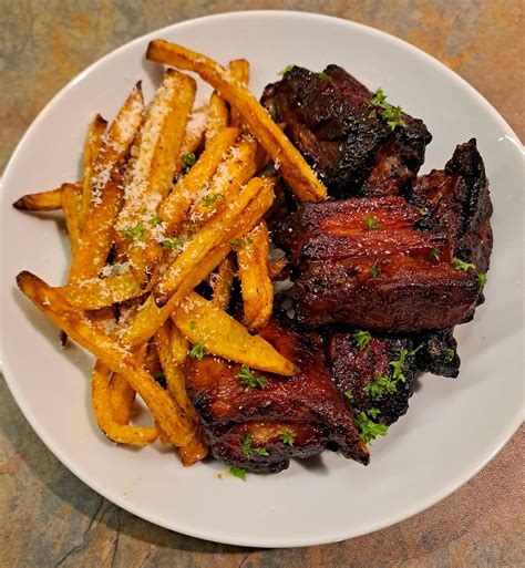 Sticky Bbq Pork Belly Ribs With Garlic And Parmesan Fries Dining And Cooking