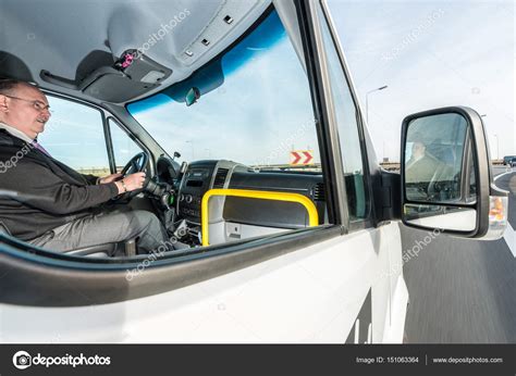 Professional male cab driver Stock Photo by ©Corepics 151063364