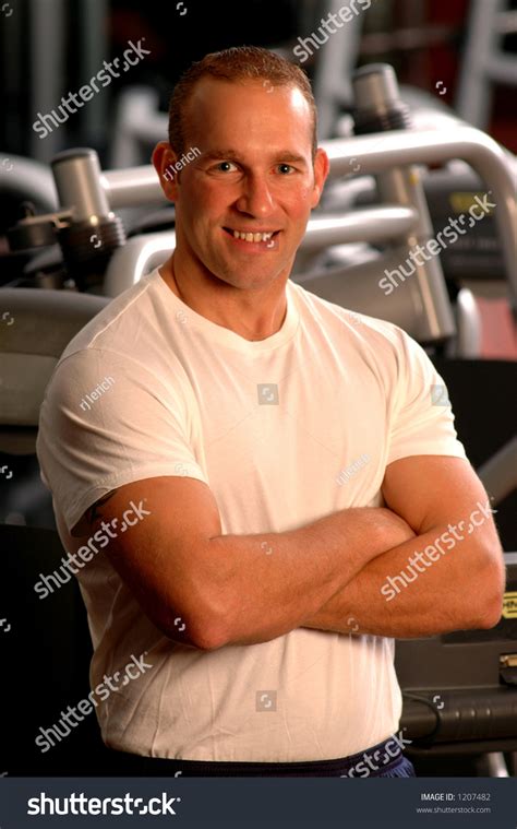 Strong Man Flexing Muscles Gym Stock Photo Edit Now 1207482