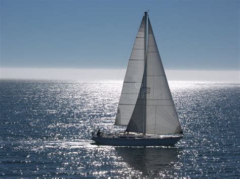 Sailboat Gliding On Calm Sea Stock Photo Image Of Yacht White