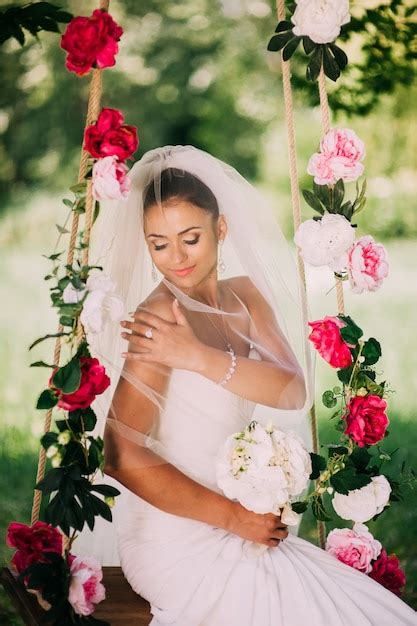 Premium Photo Beautiful Bride Swinging On A Swing