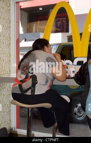 Overweight Woman Eating McDonald S Fast Food Meal Stock Photo Alamy