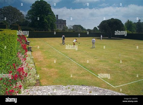 A Game Of Croquet Taking Place On The Croquet Lawn At Kingston Maurward