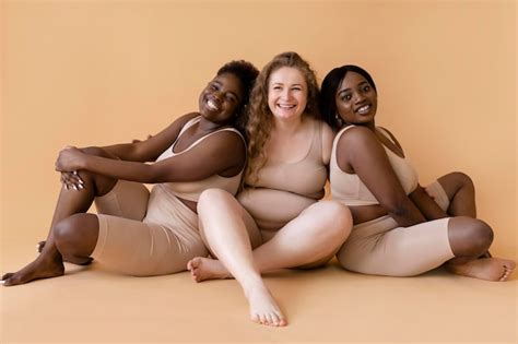 Premium Photo Three Women In Nude Body Shapers Posing Together