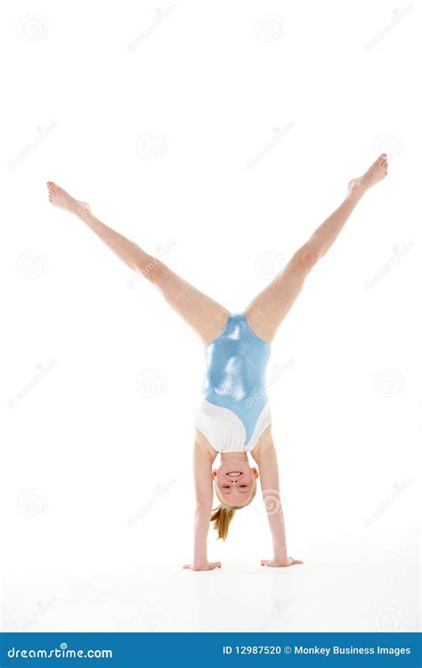 Female Gymnast Practicing Gymnastics On The Balance Beam Stock Photo ...