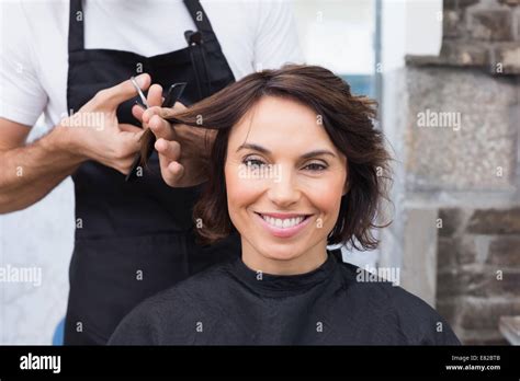 Pretty Brunette Getting Her Hair Cut Stock Photo Alamy
