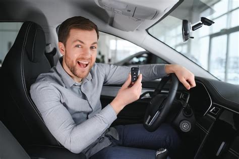 Premium Photo Successful And Happy Shot Of A Happy Mature Man Smiling To The Camera Sitting In