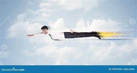 Happy Business Man Flying Fast On The Sky Between Clouds Stock Photo