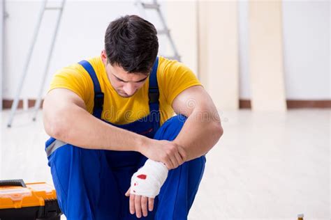 The Worker With Injured Hand At Construction Site Stock Image Image