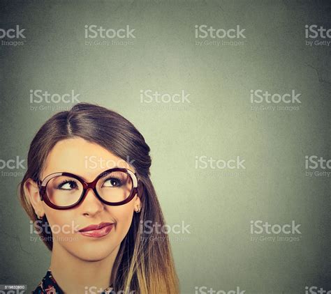 Confused Skeptical Woman In Glasses Thinking Planning Looking Up Stock