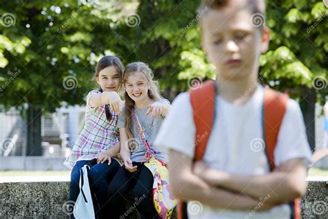 Two Girls Mocking A Boy Stock Photo Image Of Displeased 25928416