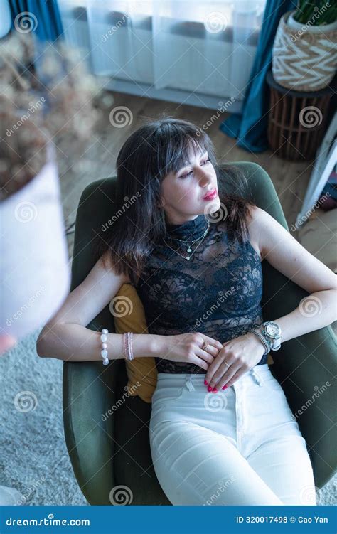 Perfect Brunette Woman With Perfect Skin Big Full Lips Posing At Bedroom Wearing Top Stock