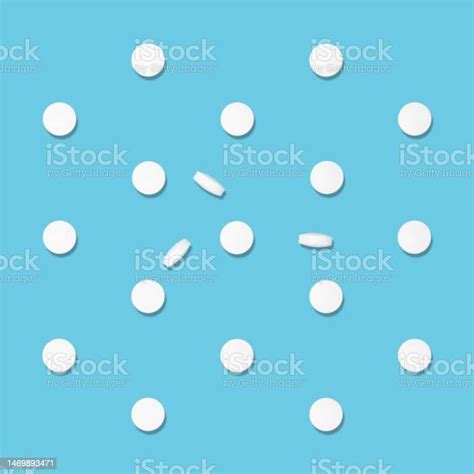 White Tablets Pattern In Hard Light On Soft Light Blue Color Top View