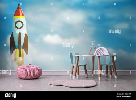 Beautiful wallpaper with image of rocket in child's room interior Stock ...