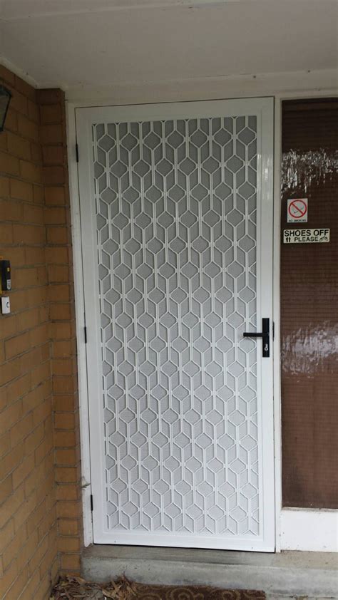 The Front Door Is Decorated With Decorative Glass Panels