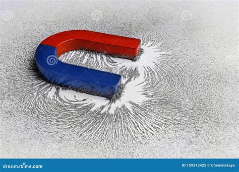 Red And Blue Horseshoe Magnet With Iron Filings Stock Image Image Of