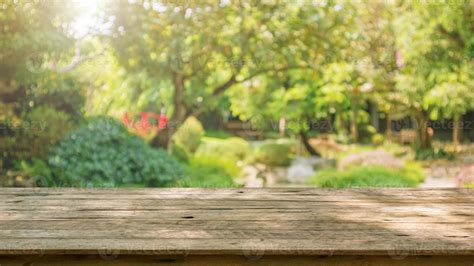 Empty Wood Table Top With Abstract Blur Park Garden Pond Background