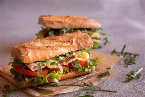 Premium Photo Baguette Sandwich With Cheese Ham Tomatoes And Vegetables