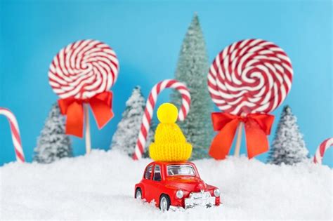 Premium Photo Red Santa Car With In Yellow Winter Cap And Christmas