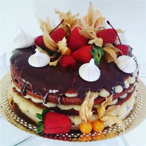 A Cake With Chocolate Frosting And Strawberries On Top