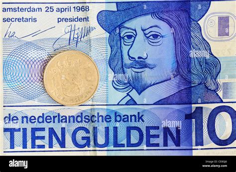 Dutch 10 Guilders Banknote and 1 Guilder Coin Stock Photo - Alamy