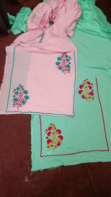 Two Pink And Green Bedspreads Sitting On The Floor Next To Eachother