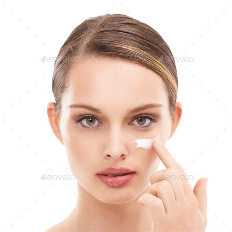 Applying a layer of moisture to her skin Stock Photo by ...