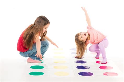 Premium Photo Two Happy Girls Play Twister Game