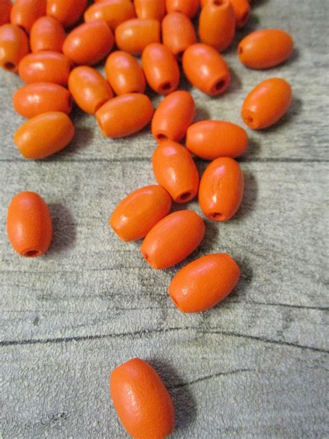 Holzperlen Orange 17x12mm Oval