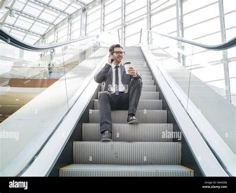 Man Sitting On Escalator Hi Res Stock Photography And Images Alamy